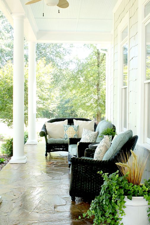 A living room filled with furniture and a large window