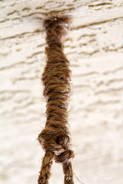 rope wrapped around bolt in ceiling hanging ladder