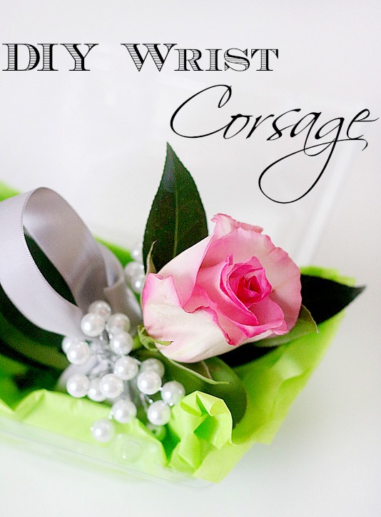 DIY wrist corsage with pink rose on green tissue