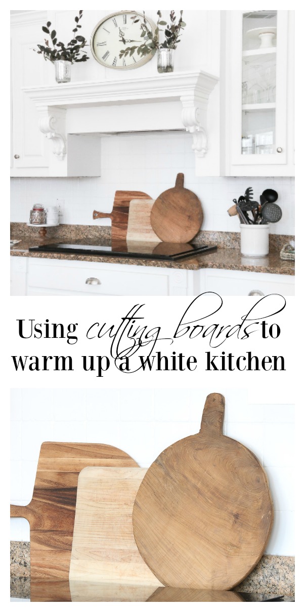 Create warmth in a white kitchen using cutting boards - Duke Manor Farm by  Laura Janning