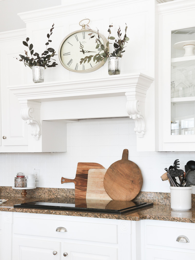 Create warmth in a white kitchen using cutting boards - Duke Manor Farm by  Laura Janning