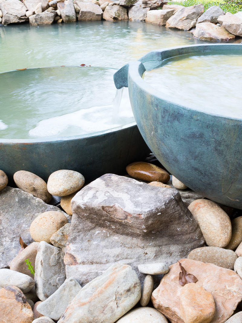 Spillway bowl and basin in a backyard pond