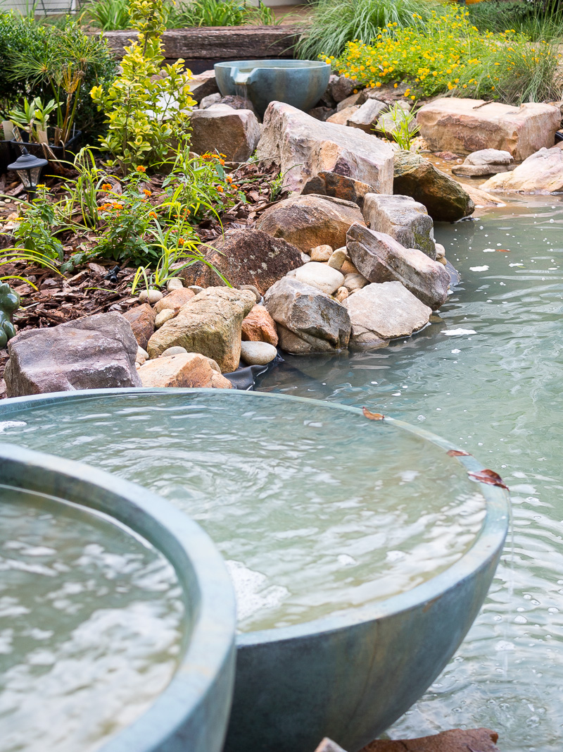 Spillway bowl and basin in a backyard pond