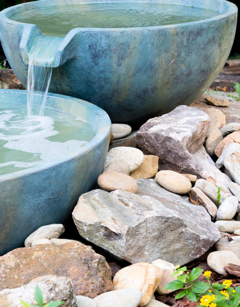 Spillway bowl and basin in a backyard pond