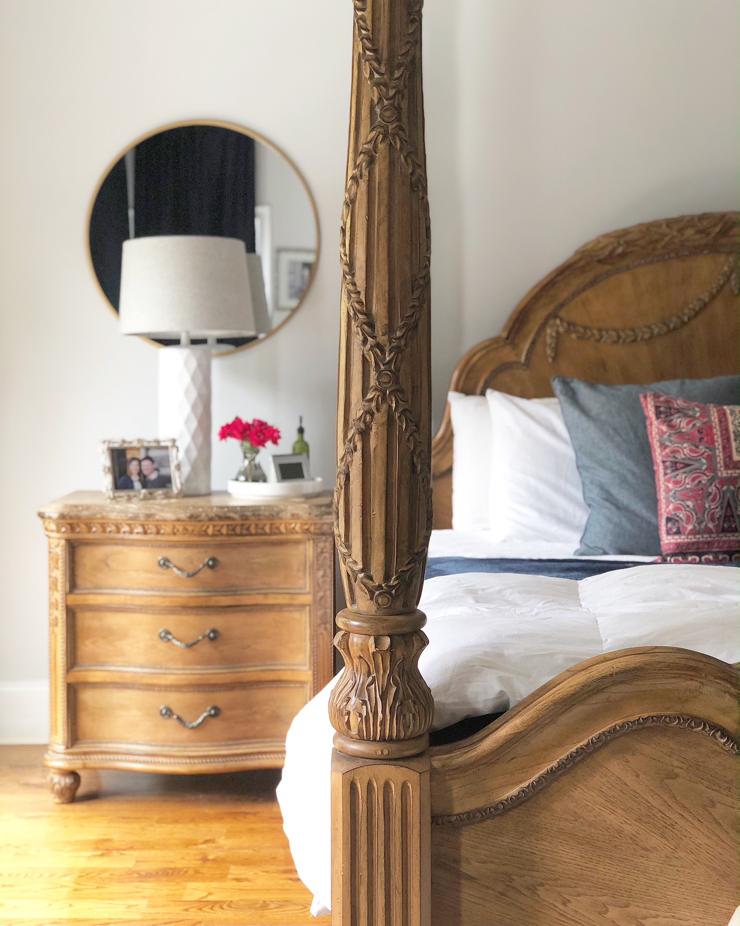 wood bed frame and nightstand with with white bedding