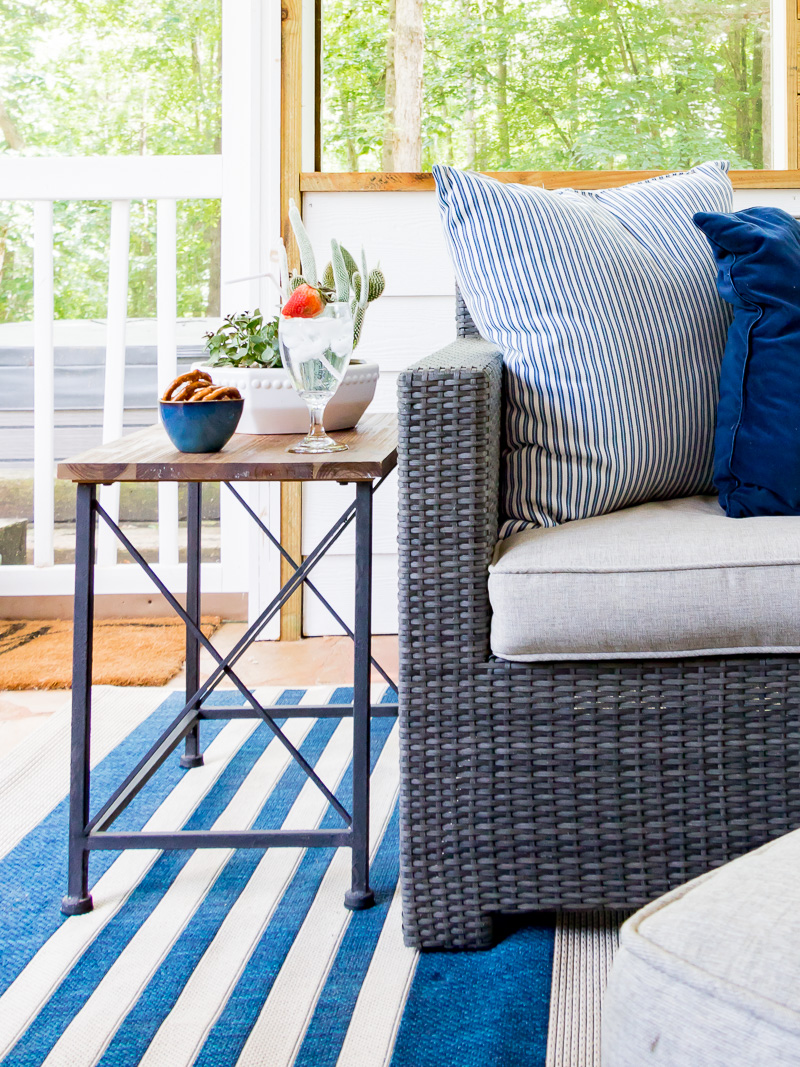 outdoor patio space, sectional with stripe pillow