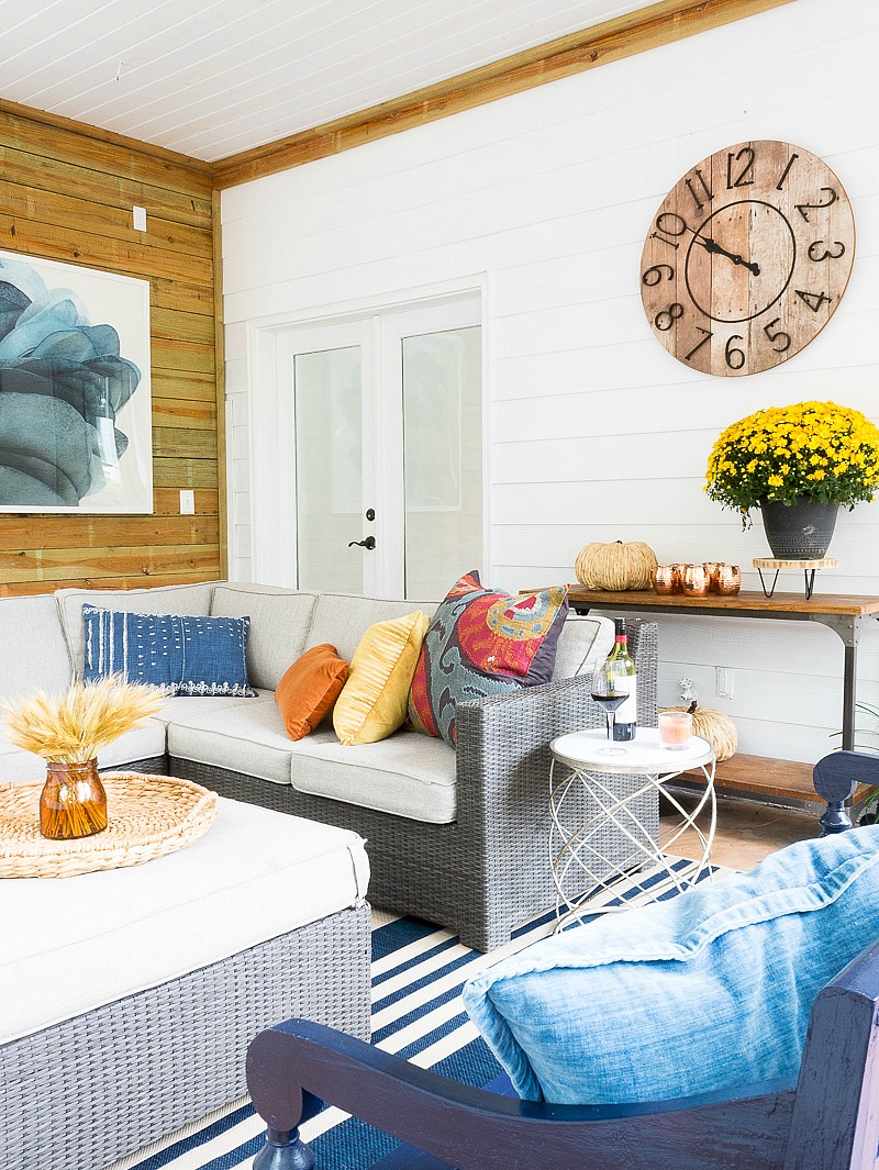 outdoor porch area with colors of blue, rust and mustard