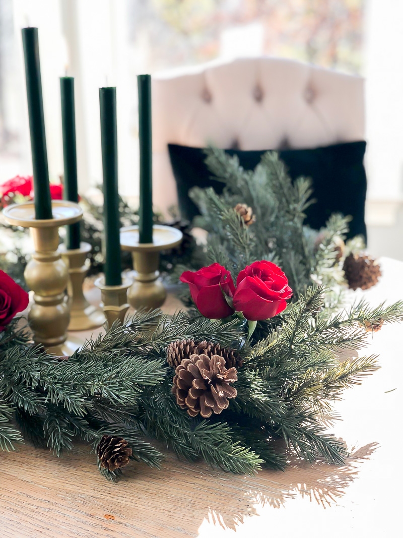 Create a festive holiday arrangement using grocery store flowers