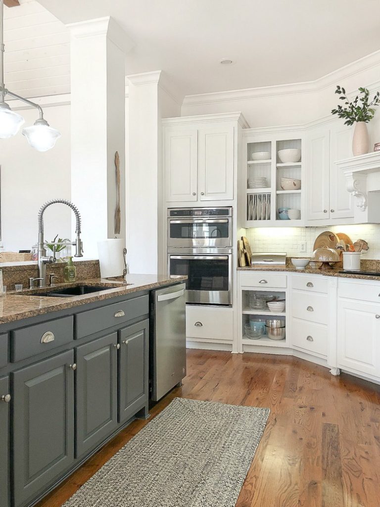 Create warmth in a white kitchen using cutting boards - Duke Manor Farm by  Laura Janning