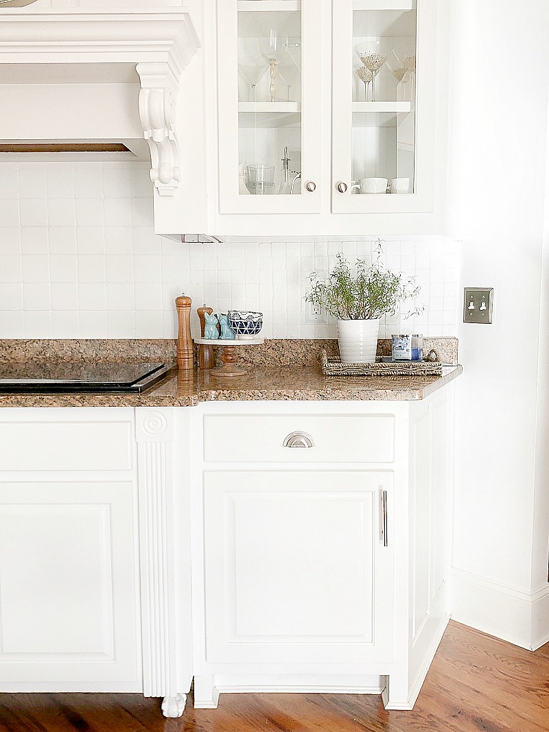 white cabinets with glass fronts