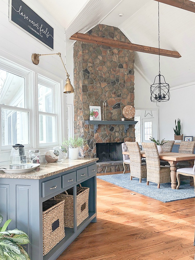 dining room with floor to ceiling stone fireplace