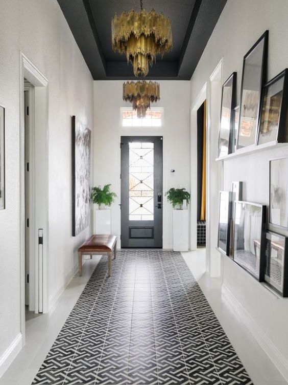 hallway with dark ceiling and white walls