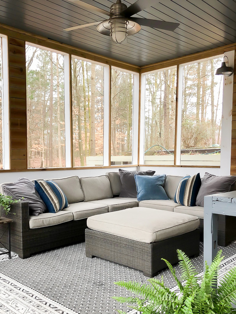 gray sectional couch in screen porch