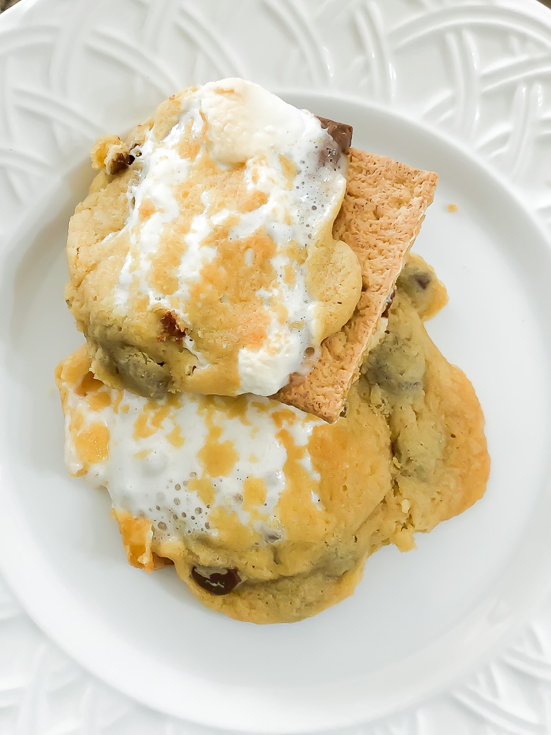 Baked s'more chocolate chip cookie on a white plate