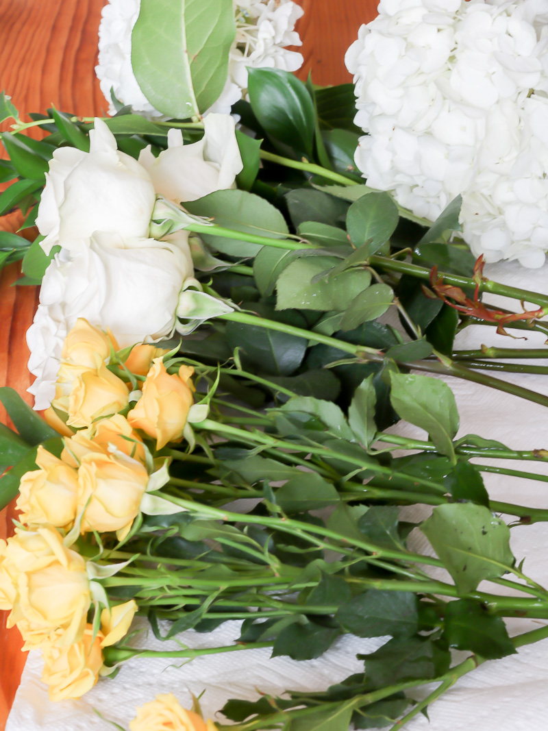 flowers on table getting ready for arrangement