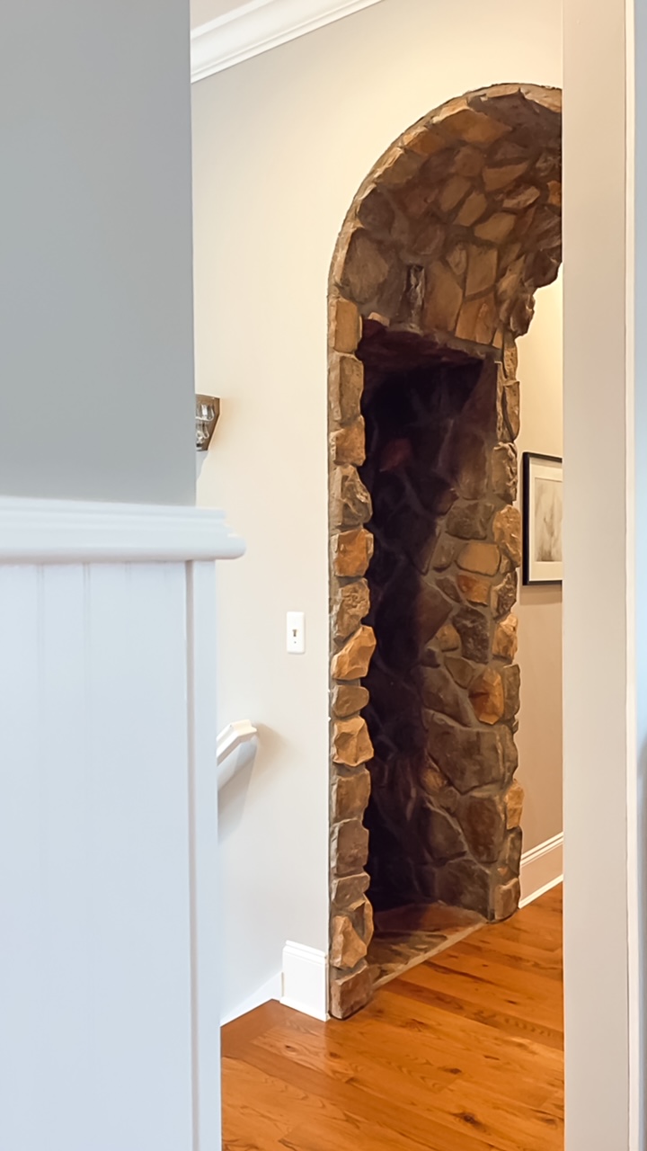 Ceiling arched and covered with stone.