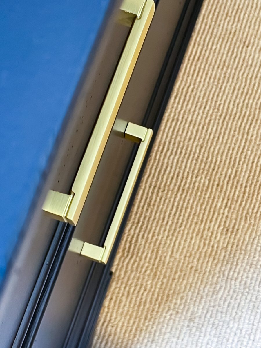brass hardware on a file cabinet