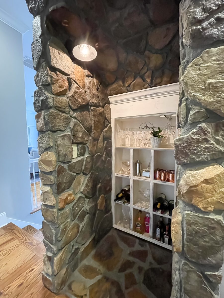 Built in wine nook under stairs.