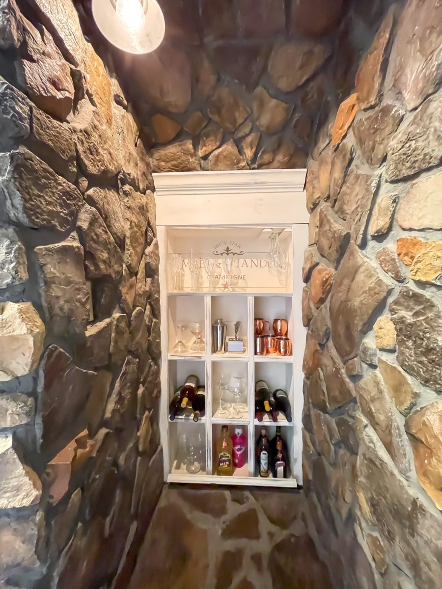 Wine nook cabinet with stone surround.