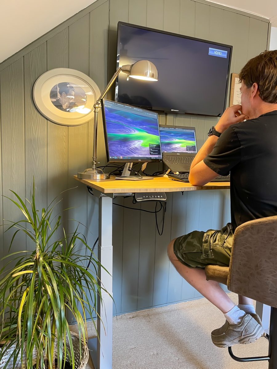 multiple monitors on standing desk