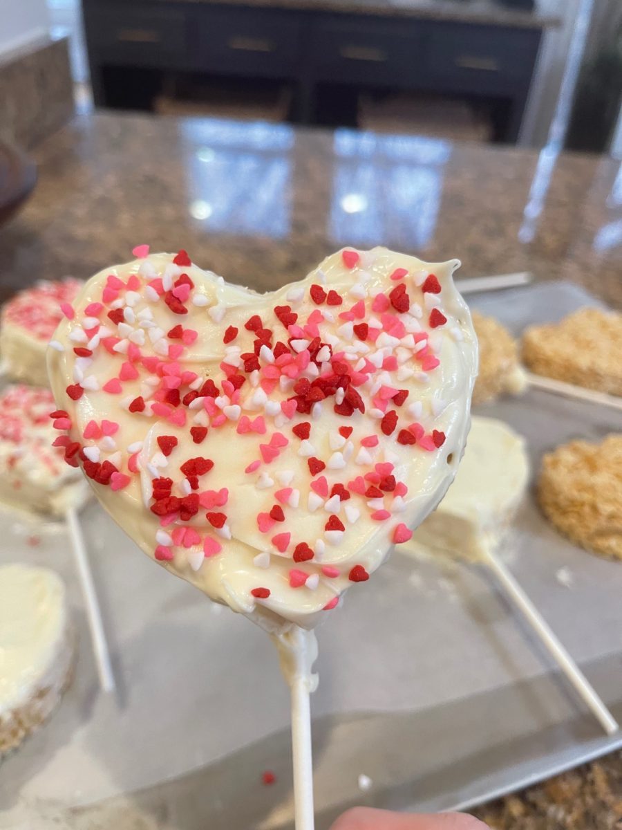 rice krispie covered with white chocolate and sprinkled with sprinkles