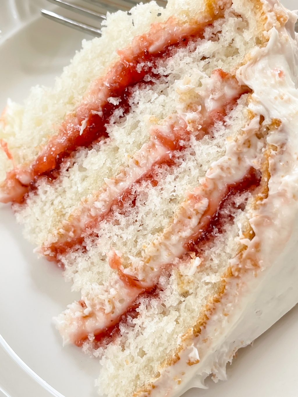 close up of white layered cake