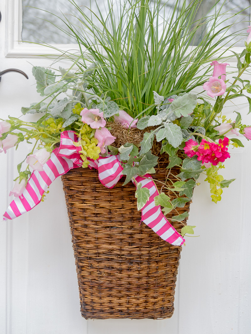 basket with fresh plant and flowers