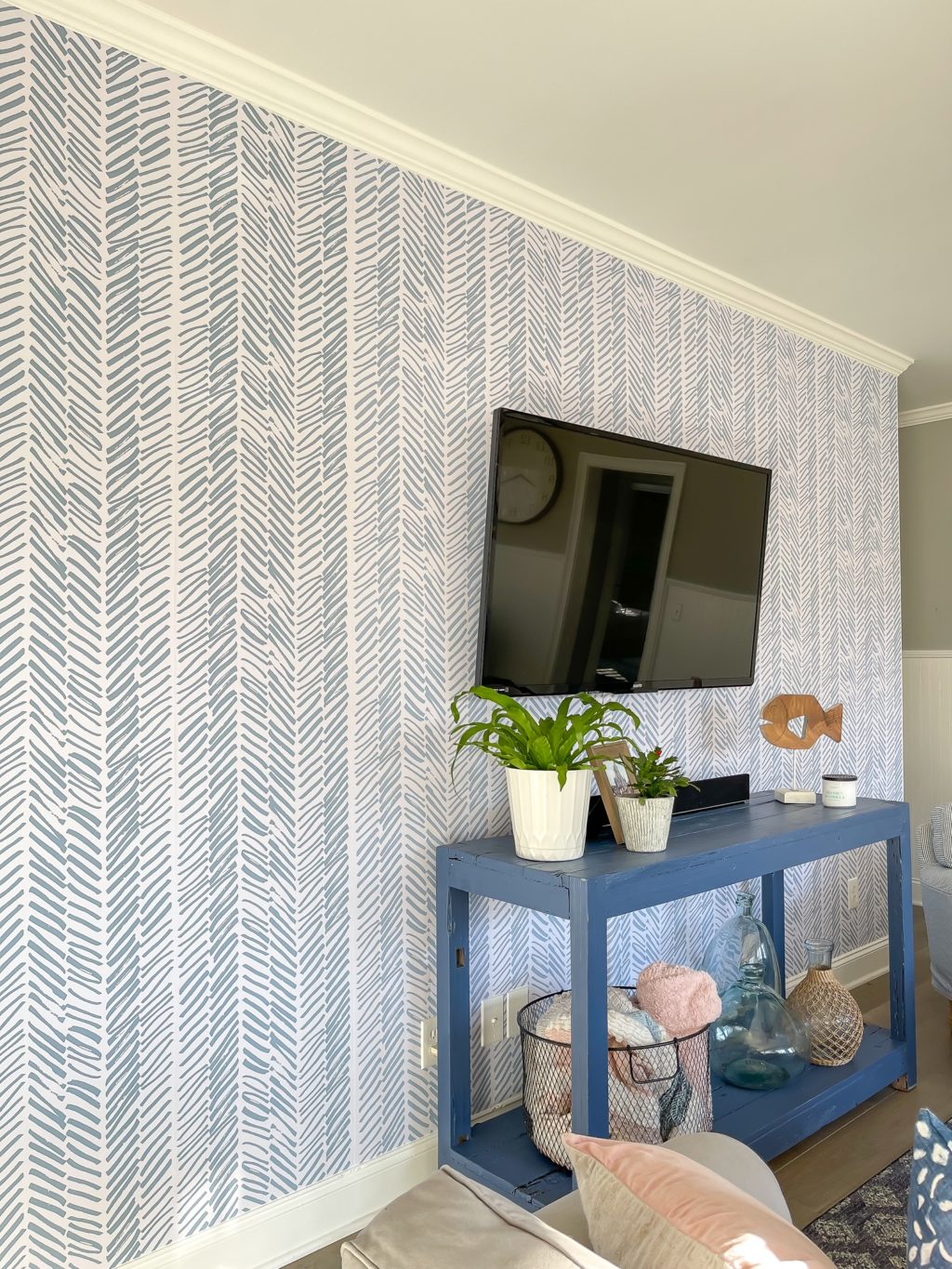 angled view of wallpaper wall with TV