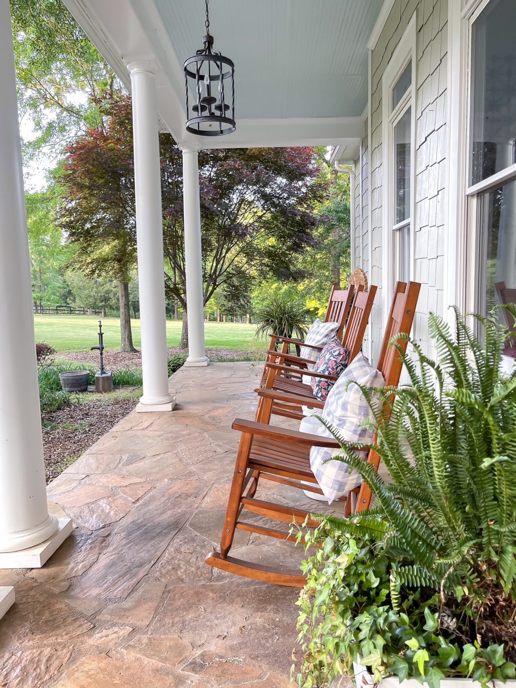 covered front porch with rockers