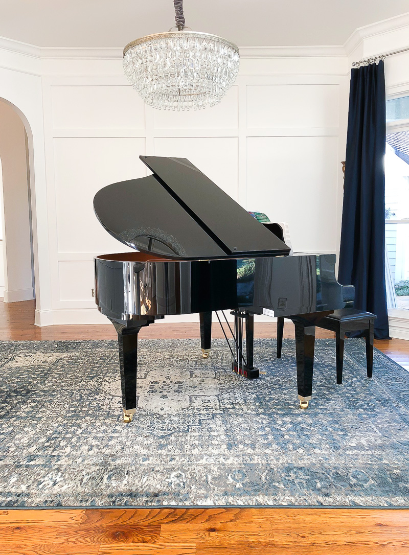 Baby grand piano with hanging chandelier from Pottery Barn