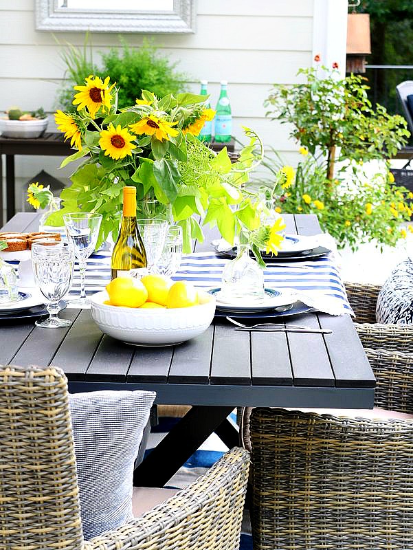 summertime table with sunflower arrangement in the center