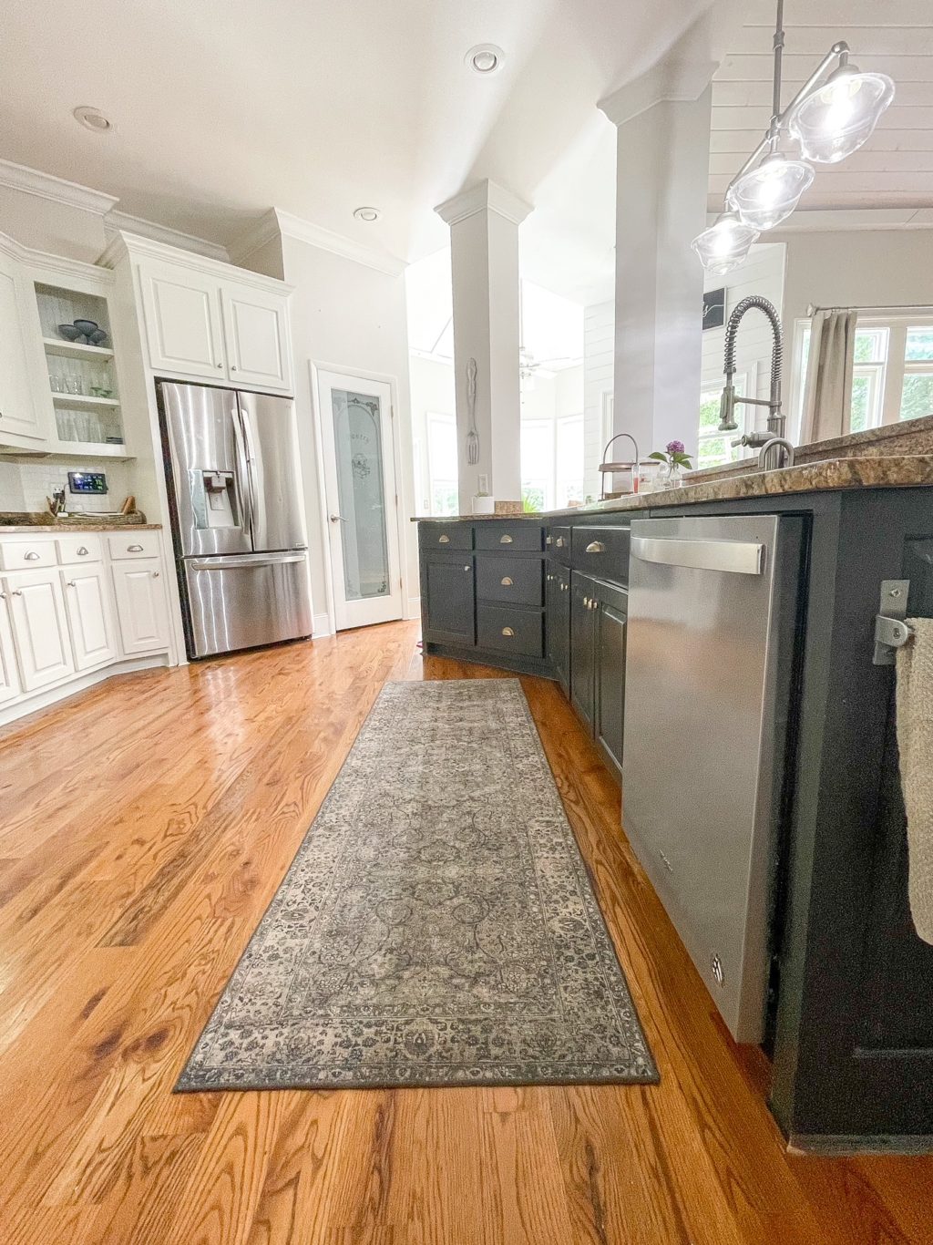 tips on how to care for area rugs including blue runner in the kitchen