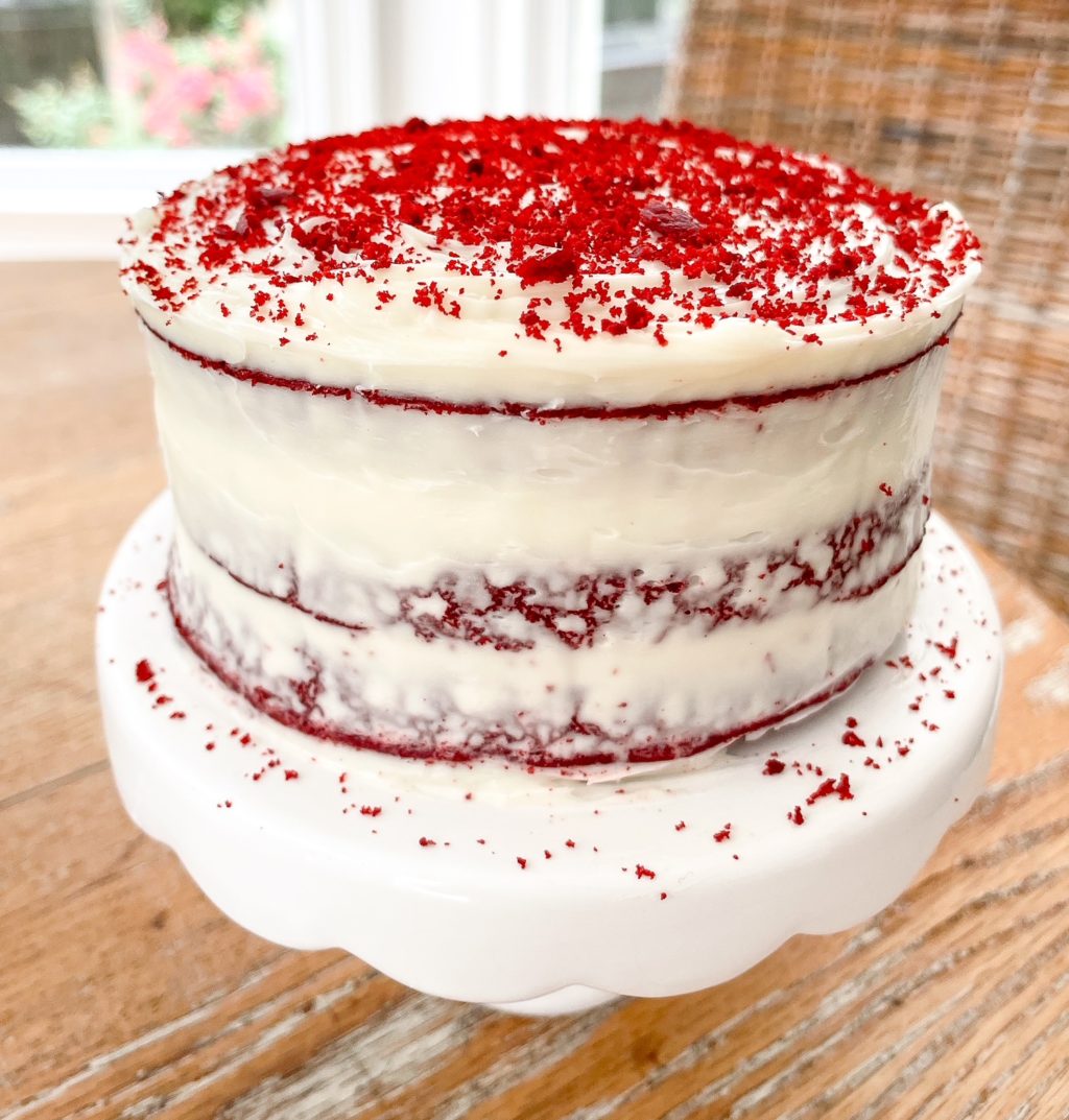 red velvet cake on a white cake stand