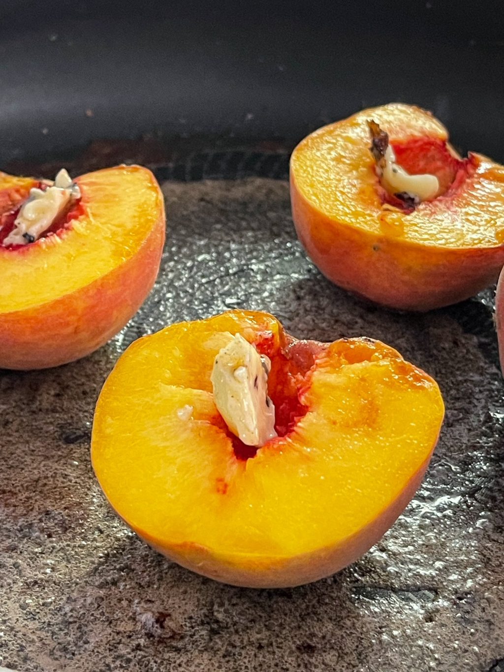 peaches cut in half with butter