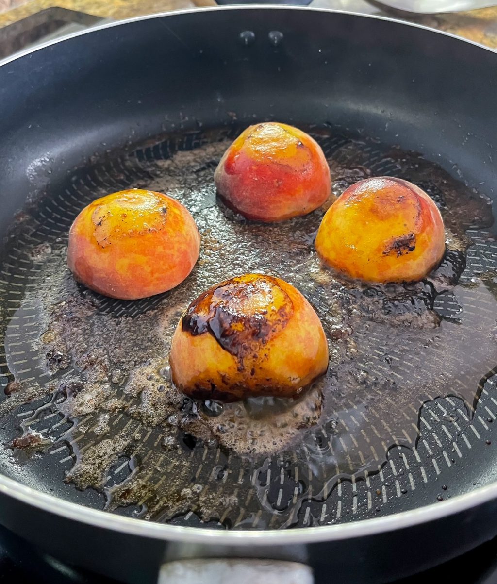 fried peaches in frying pan