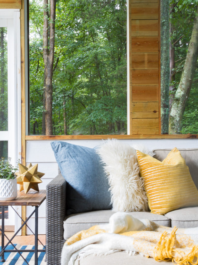 outdoor sectional with mustard yellow pillow