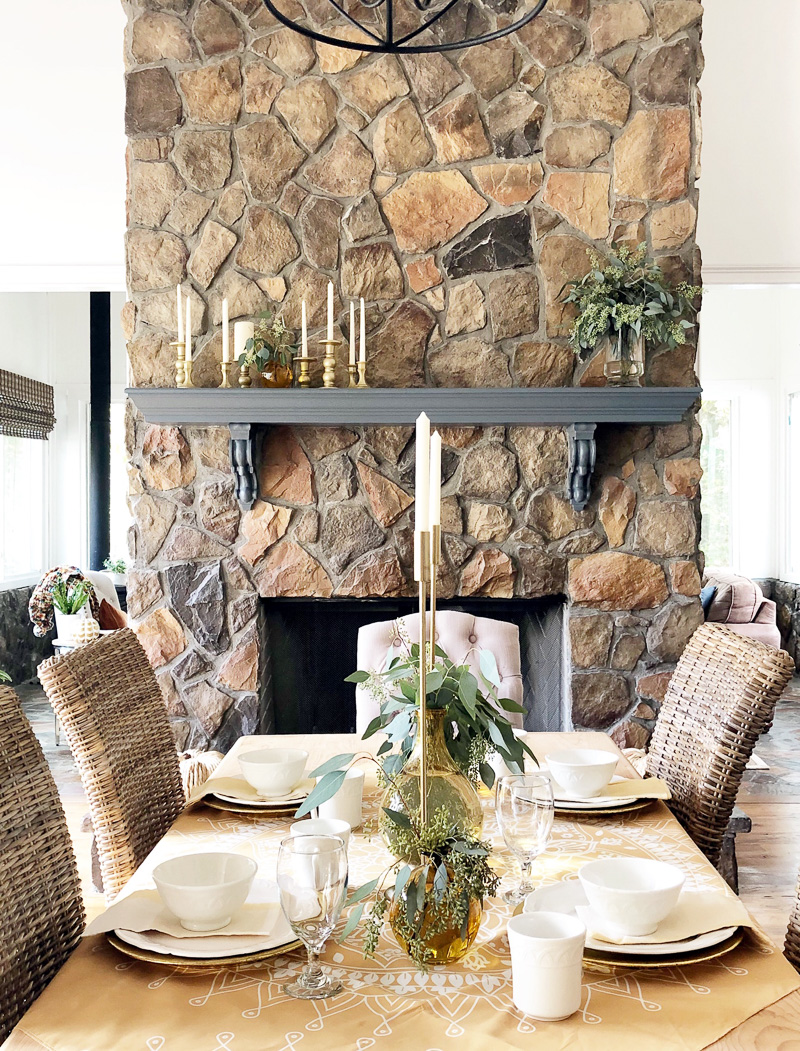 dining room with stone fireplace