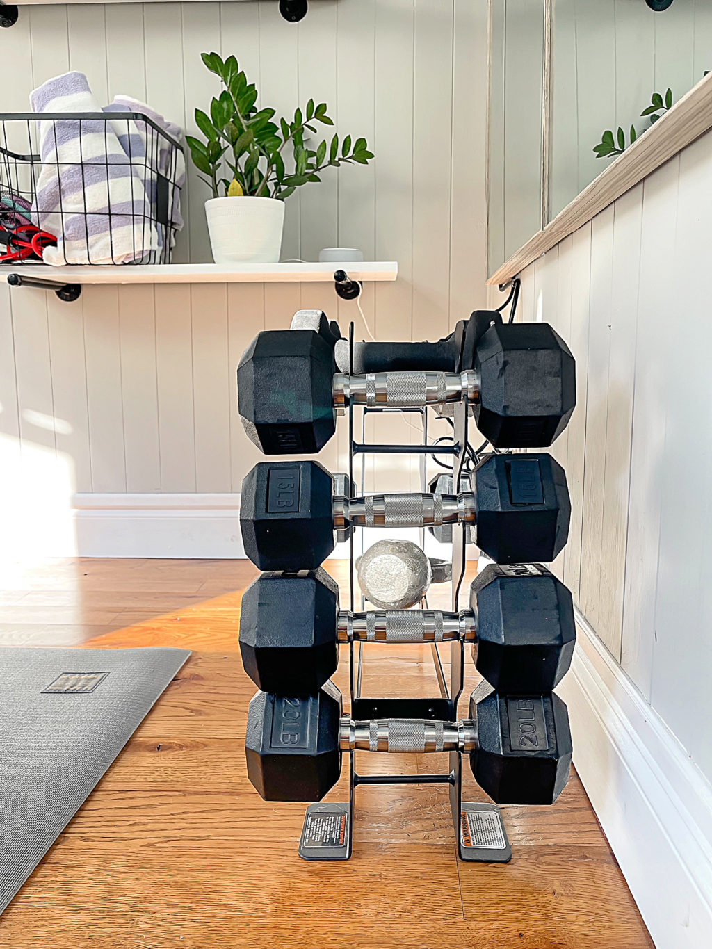Small compact weight bench in a home gym.
