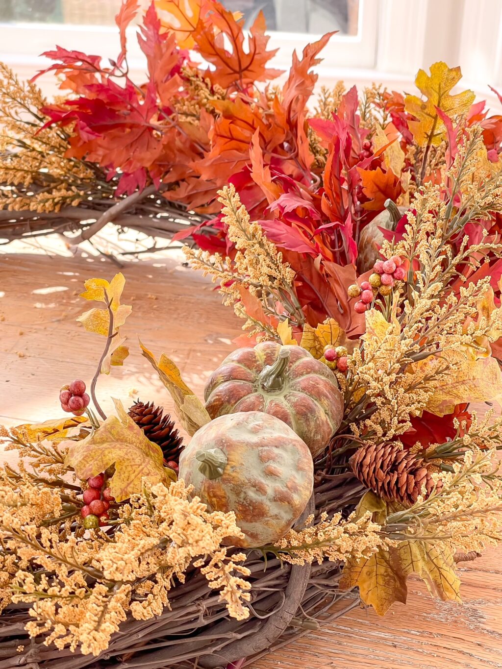 Beautiful fall floral picks on a grapevine wreath.