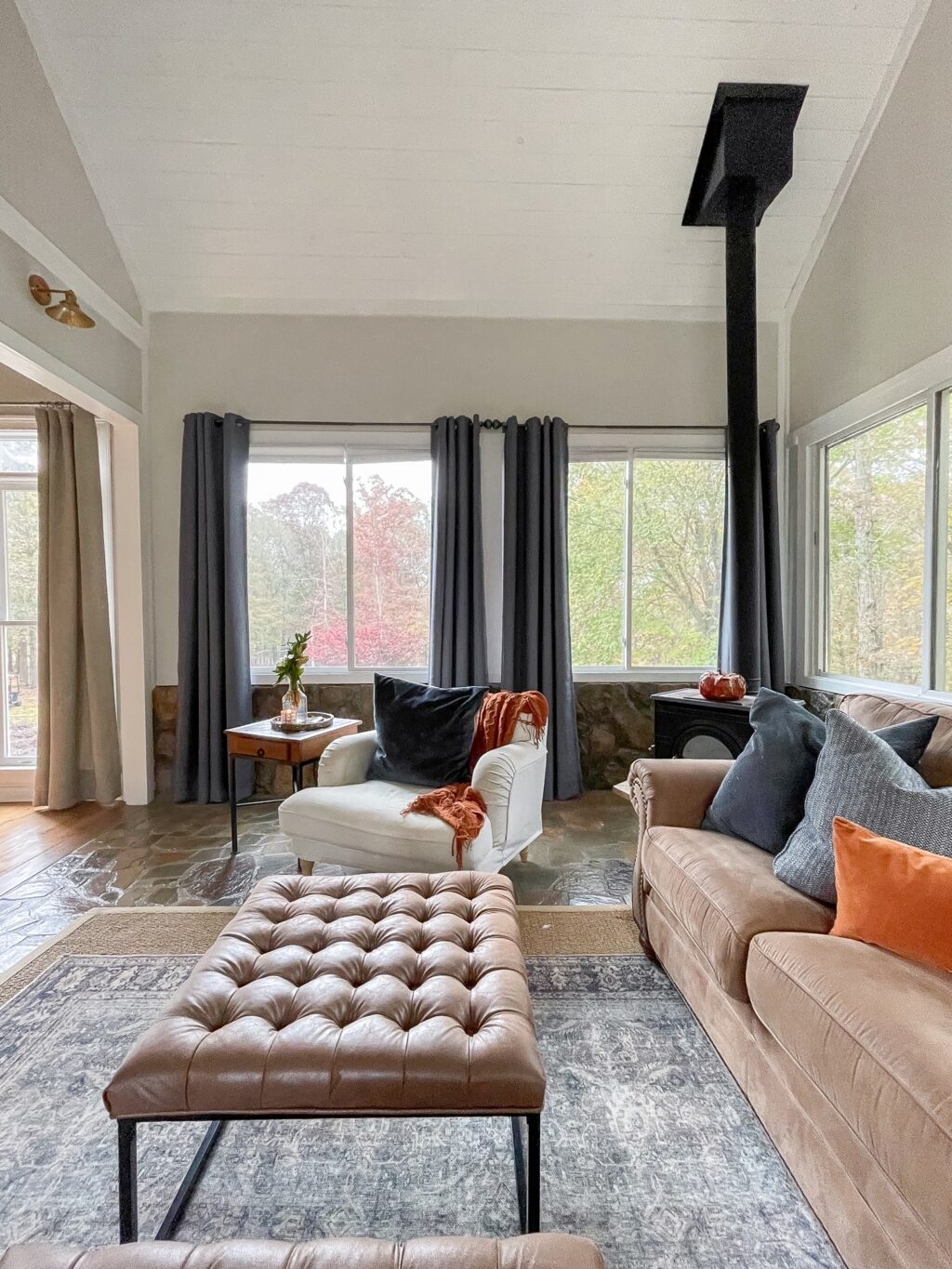 brown ottomans, brown sofa and white accent chair