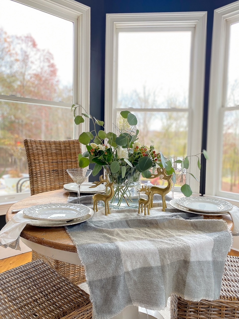 Holiday table setting with roses and brass deer