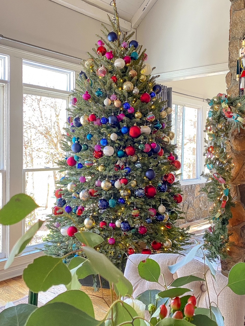christmas tree filled with colored ornaments