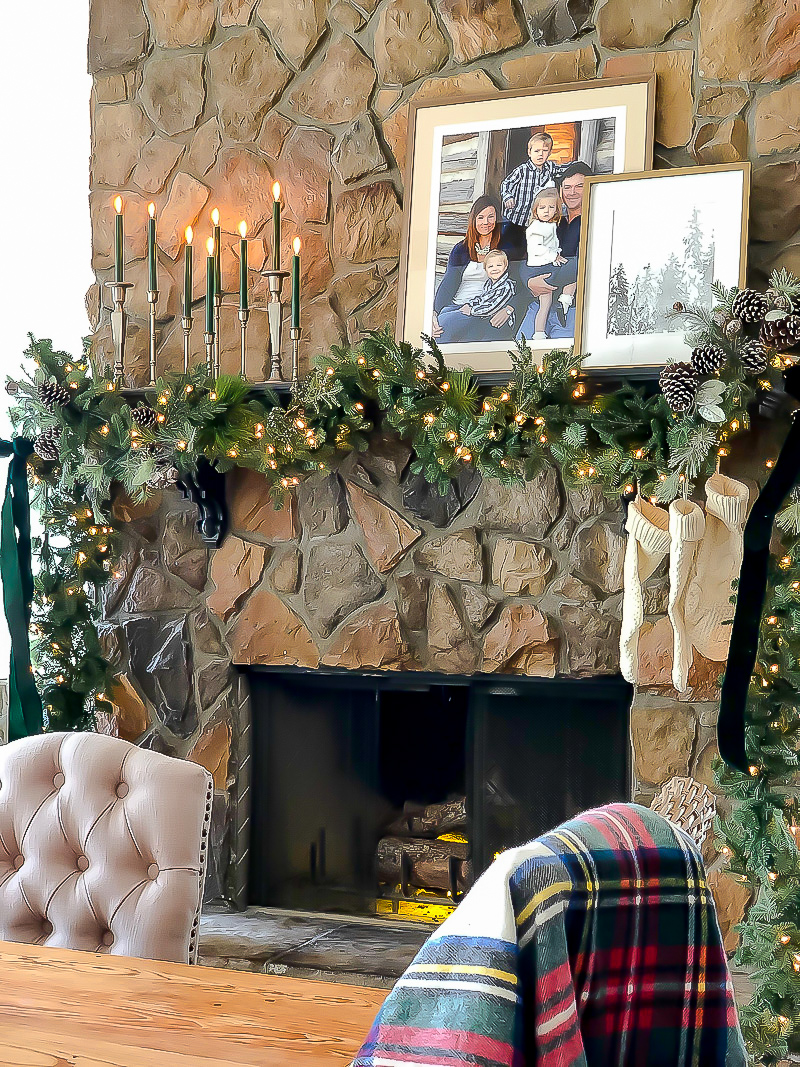 fireplace and mantel with candlesticks and garland