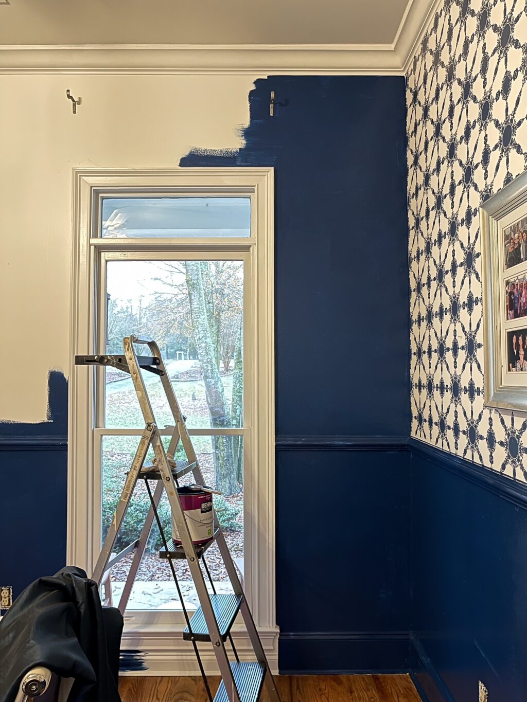 Painting over white walls with navy blue.