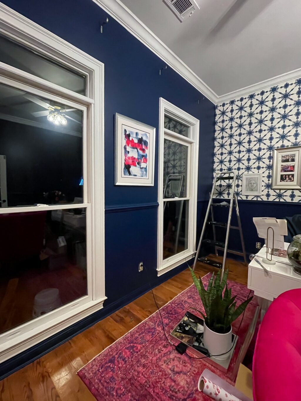 Progress of home office makeover with compass blue by behr on the walls.