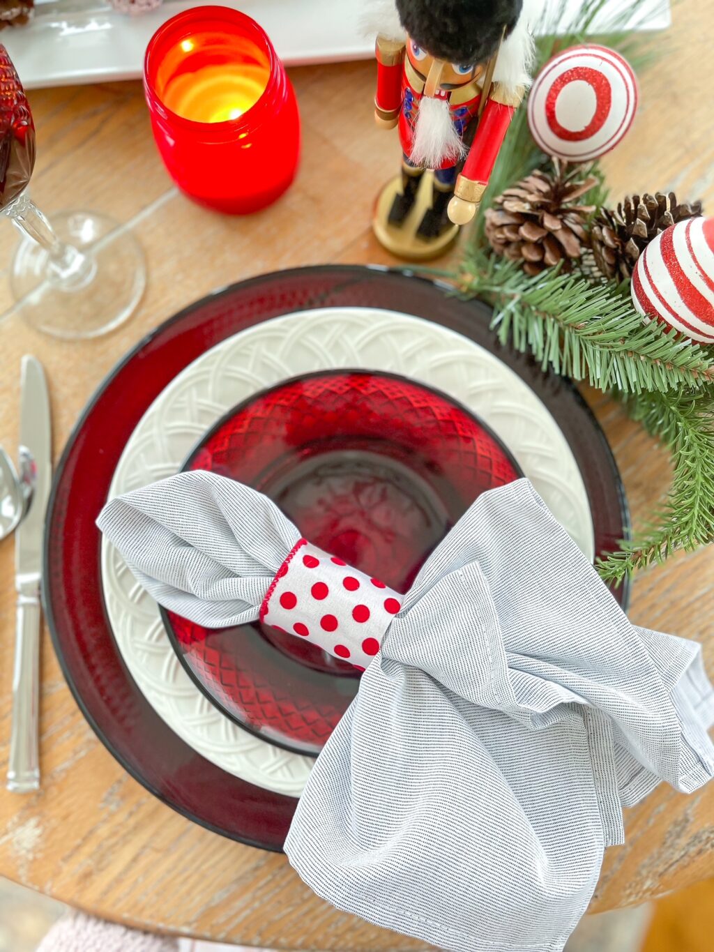 red and white napkin ring with red and white plates