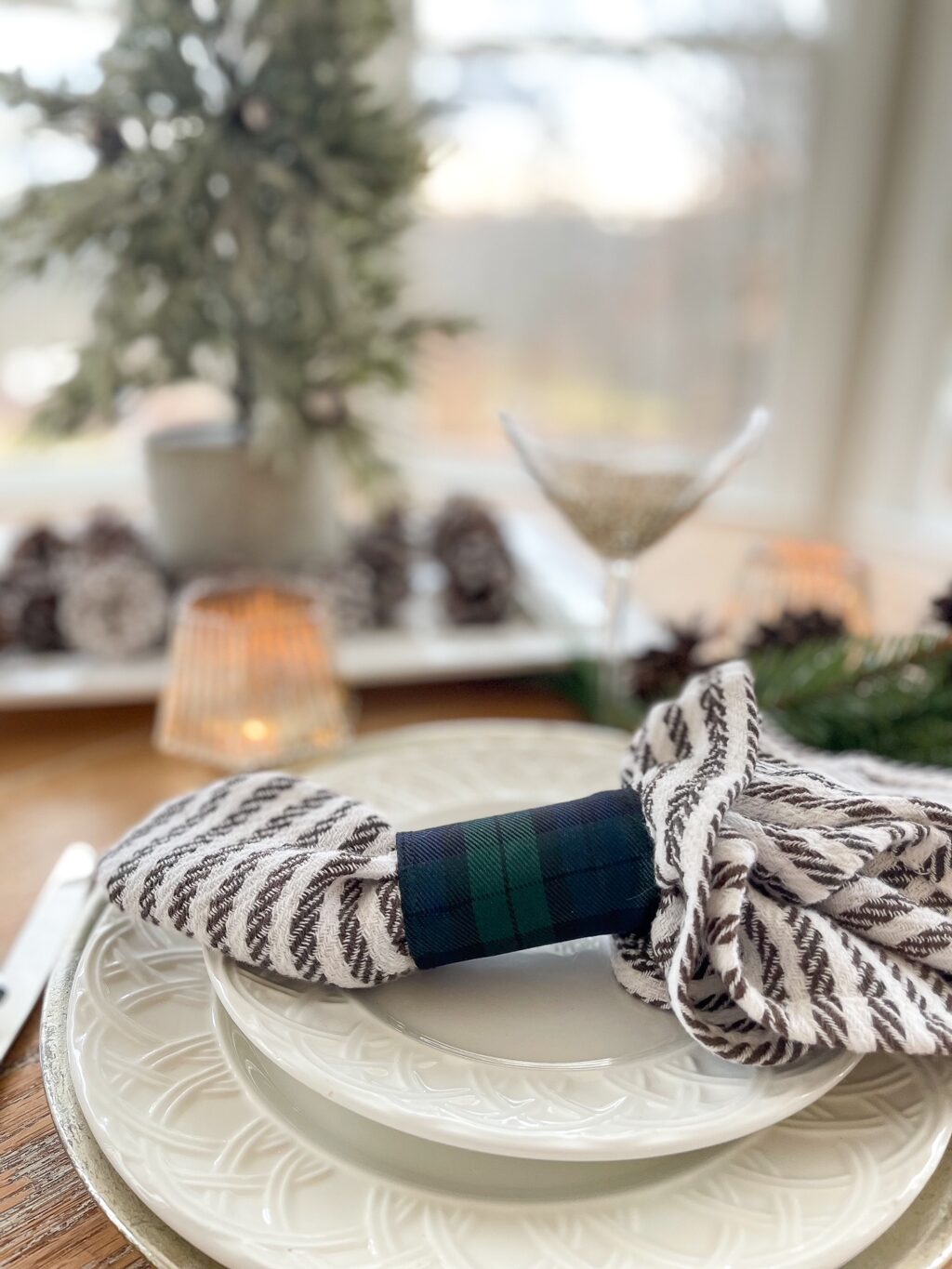 Tablescape using a DIY holiday napkin ring with blue plaid ribbon