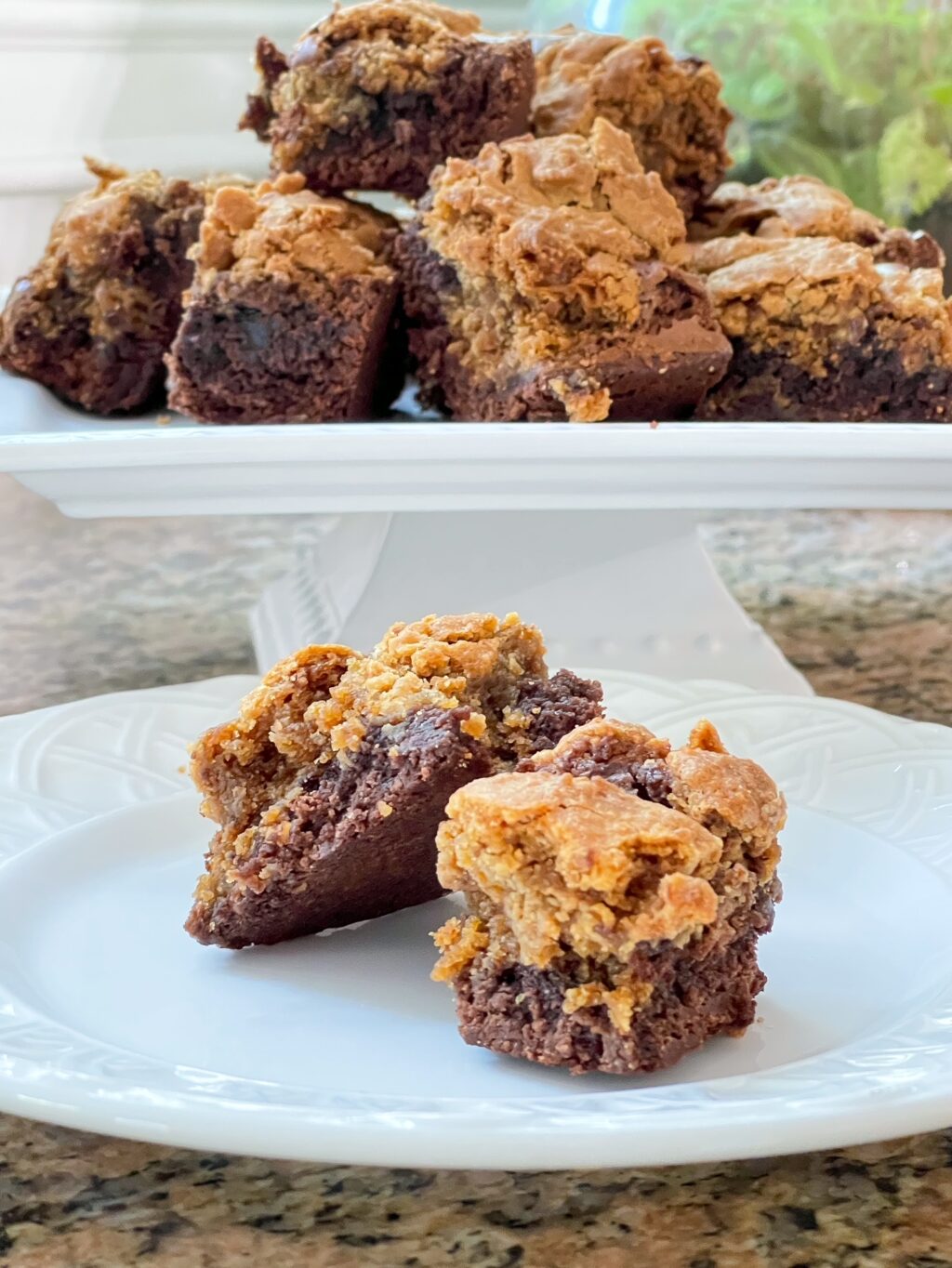 white plate with peanut butter cookie brownies