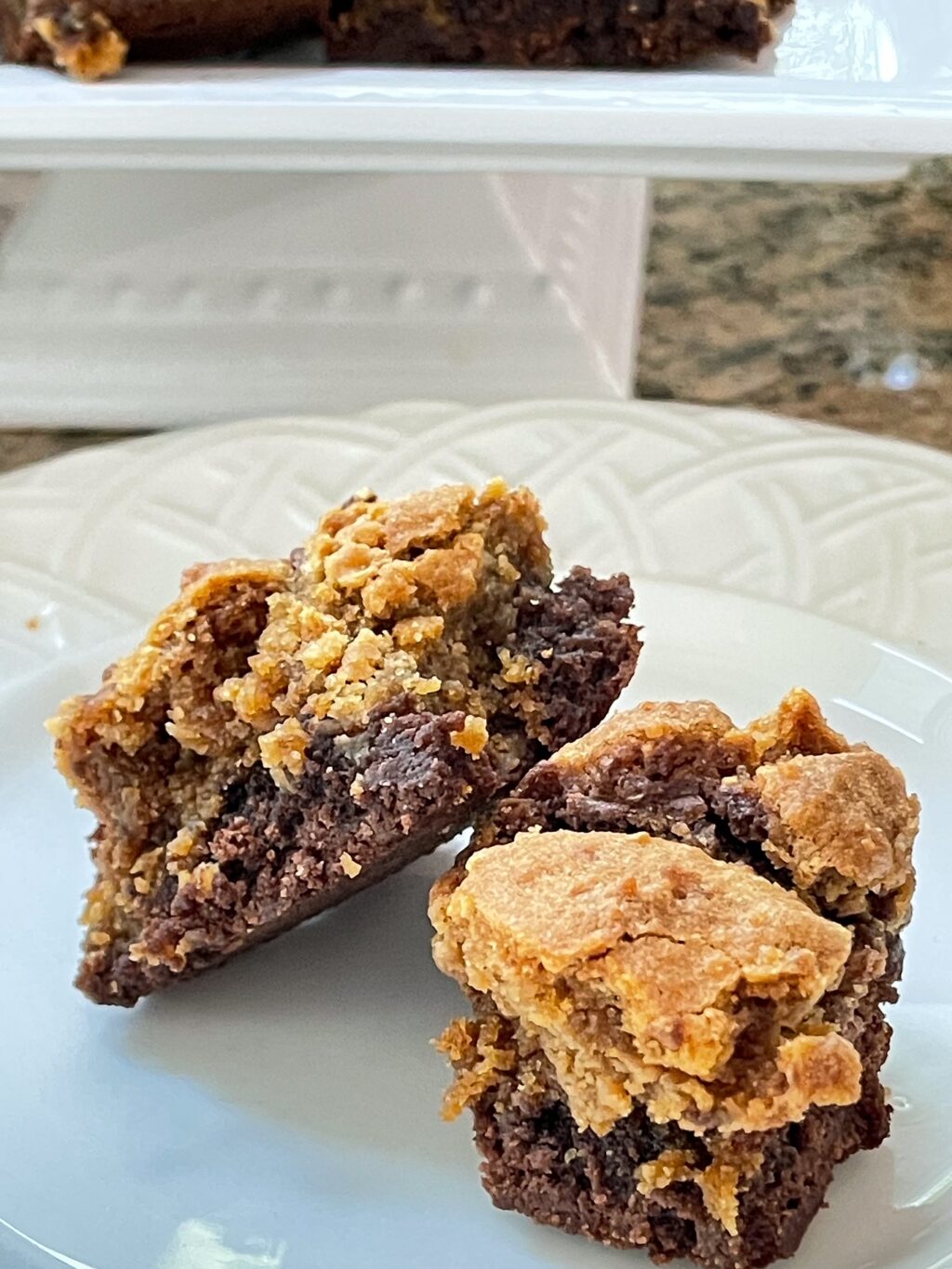 white plate with two peanut butter cookie brownie close up