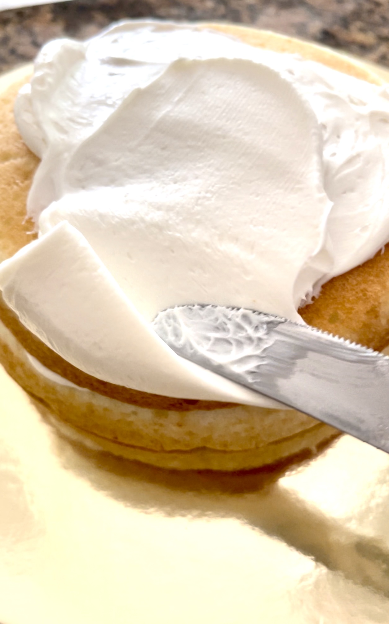 white frosting on top of cake